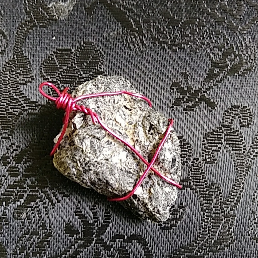 Wire wrapped healing stone pendant